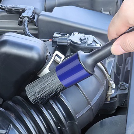 Detail brush dusting an engine bay